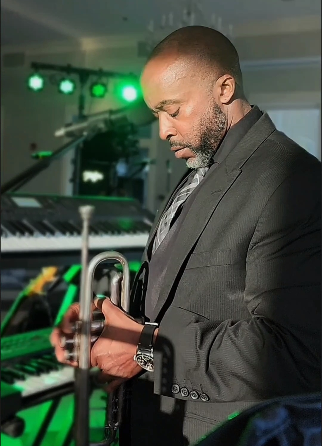 Joe Just JoE Anderson holding trumpet during a live performance